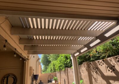 Custom pergola with louvered roof designed and created by Arizona Shade Company