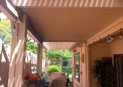 Custom pergola with louvered roof designed and created by Arizona Shade Company