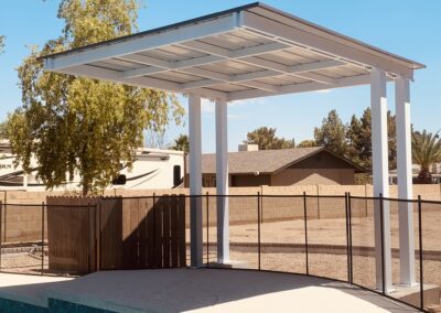 Custom shade structure for a swimming pool designed and created by Arizona Shade Company